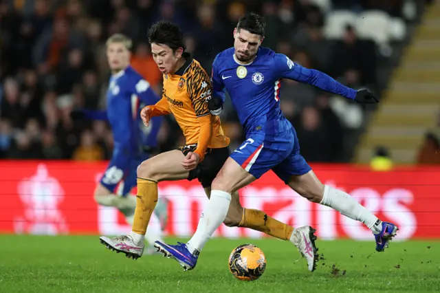 Yu Hirakawa of Hull City and Pedro Neto of Chelsea challenge