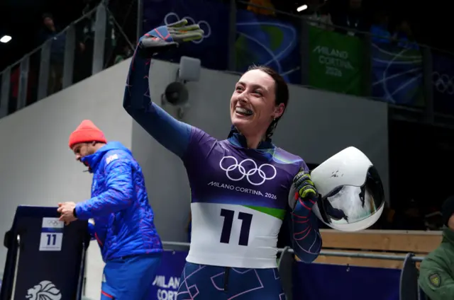 Great Britain's Freya Tarbit celebrates after heat two of the Women's Skeleton at the Cortina Sliding Centre, on day seven of the Milano Cortina 2026 Winter Olympics, Italy