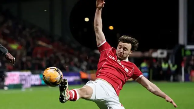 Oliver Rathbone of Wrexham attempts to block during the Emirates FA Cup Fourth Round match between Wrexham and Ipswich Town