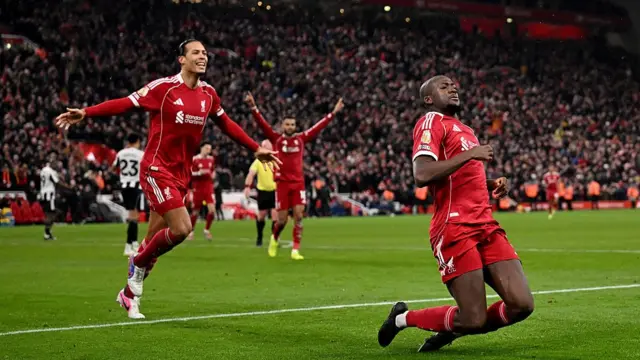Virgil van Dijk celebrates with Ibrahima Konate