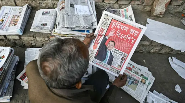 top view of a man reading a newspaper