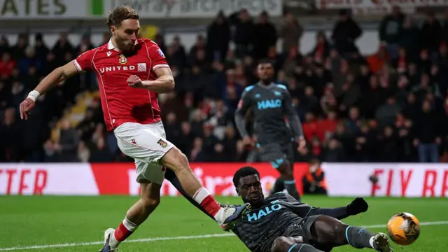 Sam Smith of Wrexham shoot during the Emirates FA Cup Fourth Round match between Wrexham and Ipswich Town