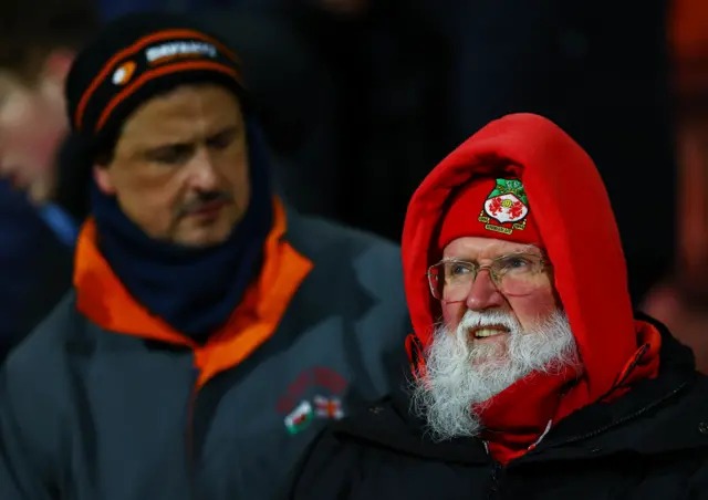A Wrexham fan looks on