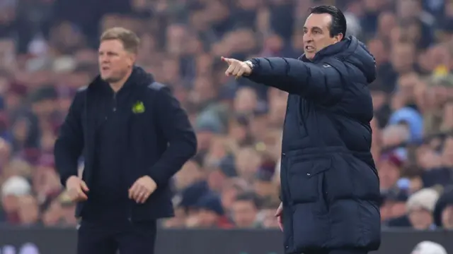Eddie Howe and Unai Emery stand on the touchline
