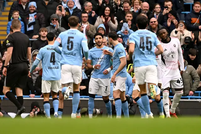 City celebrate the opening goal with the home fans