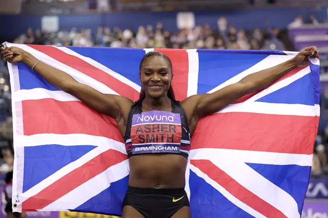 Dina Asher-Smith of Great Britain celebrates after winning the 60m final during day one of the UK Athletics Indoor Championships