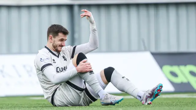 Dundee United's Kristijan Trapanovski picks up an injury