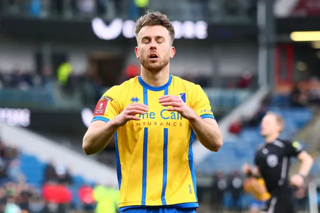 Rhys Oates reacts after missing a chance