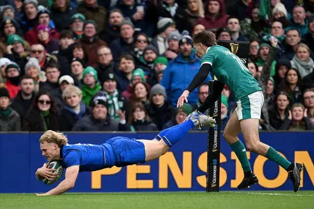 Louis Lynagh dives for the line as Sam Prendergast tries to tackle