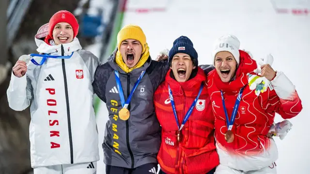 Philipp Raimund (second left) with the other normal hill medallists