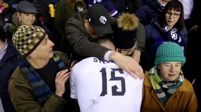 Freddie Steward is consoled by his parents
