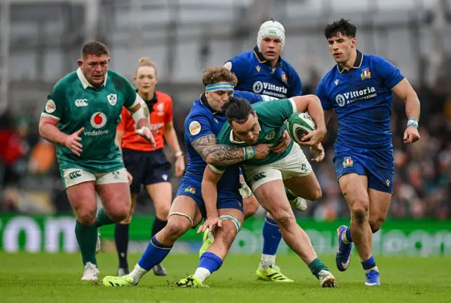 James Lowe is tackled against Italy