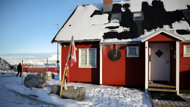A person walks near the US Consulate in Nuuk, Greenland