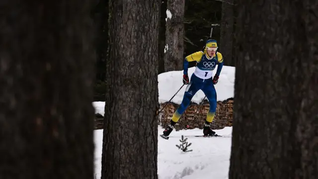 Oleksandra Merkushyna competes in the women's biathlon
