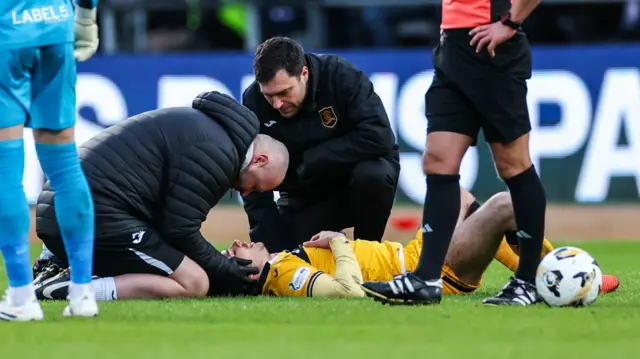 Livingston's Macaulay Tait recieves treatment after going down injured