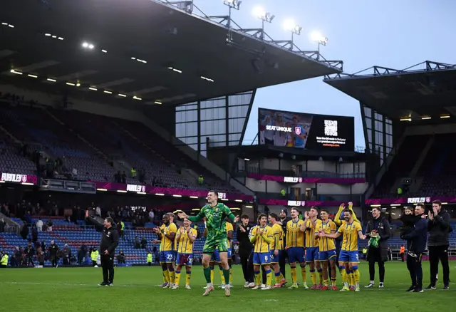 Mansfield players and staff celebrate at Turf Moor