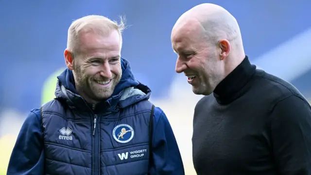 Millwall midfielder Barry Bannan smiles as he talks with his former boss and Sheffield Wednesday manager Henrik Pederson