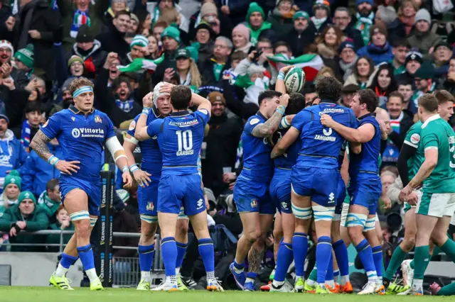 Italy players celebrate