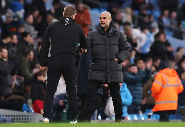 Pep Guardiola embraces Karl Robinson
