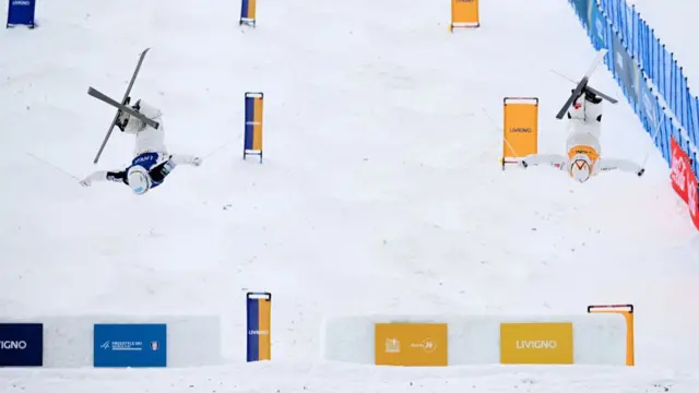 Ikuma Horishima (L) and Mikael Kingsbury (R) compete at the FIS World Cup