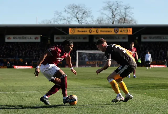West Ham United's Adama Traore in action with Burton Albion's Jack Armer