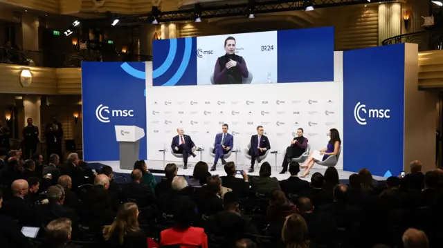 Danish Prime Minister Mette Frederiksen (on screen) during debate with Spain's Prime minister Pedro Sanchez, President of Republic of Finland and Alexander Stubb during the 62nd Munich Security Conference (MSC)