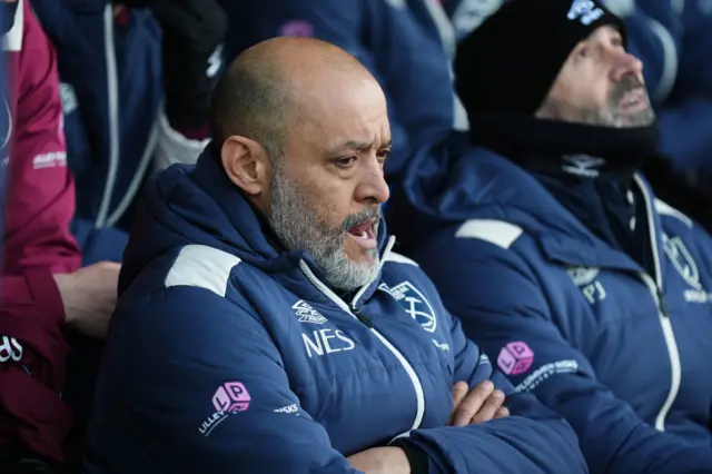 Nuno sits deep in thought on the bench