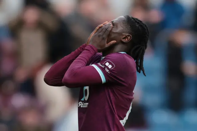 Burnley's Loum Tchaouna react