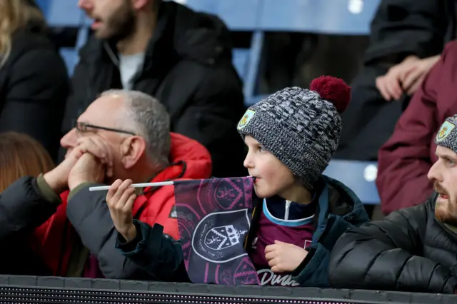 Young fan waves a Burnley flag