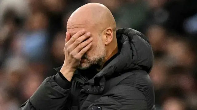 Guardiola covers his eyes
