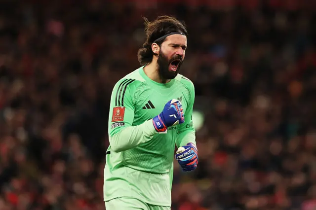 Alisson celebrates