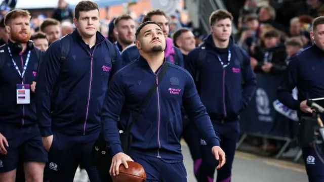 Sione Tuipulotu leads Scotland players into Murrayfield