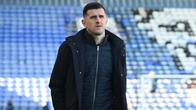Portsmouth manager John Mousinho arriving inside Fratton Park before kick-off against Sheffield United