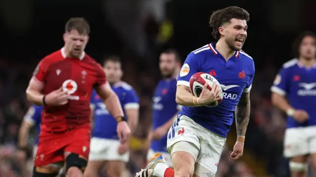 Matthieu Jalibert of France breaks away to go on and scores his team's fourth try during the Guinness Six Nations 2026