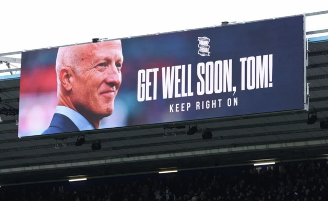 The big screen displays a message referencing Birmingham City co-owner Tom Wagner