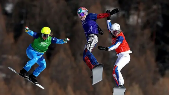 Snowboarders in action