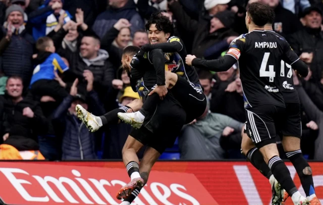 Leeds United's Lukas Nmecha (left) celebrates with Ao Tanaka (second left) after scoring his sides first goal