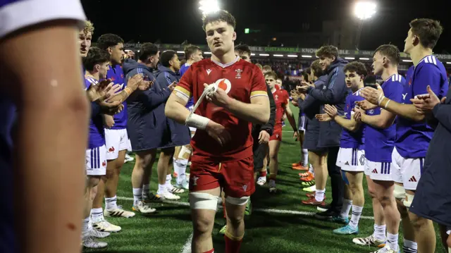 Deian Gwynne leads his Wales U20s side off through the French tunnel
