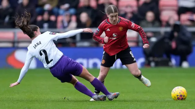 London City Lionesses' Jana Fernandez tries to tackle Manchester United's Jess Park during the Barclays Women's Super League match at Progress with Unity Stadium, Leigh.
