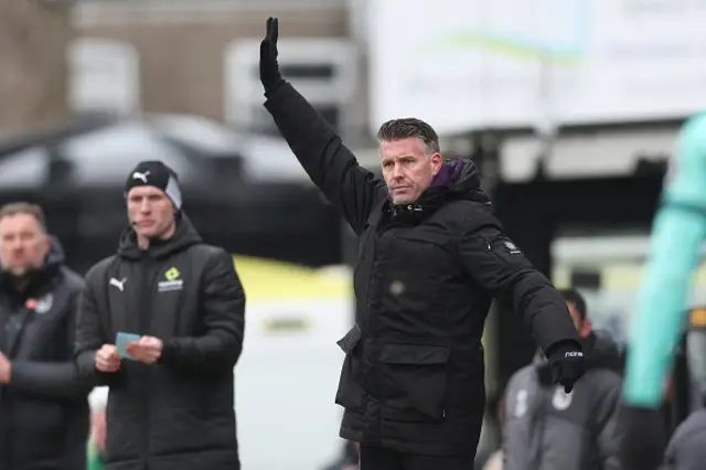 Rob Edwards looks on
