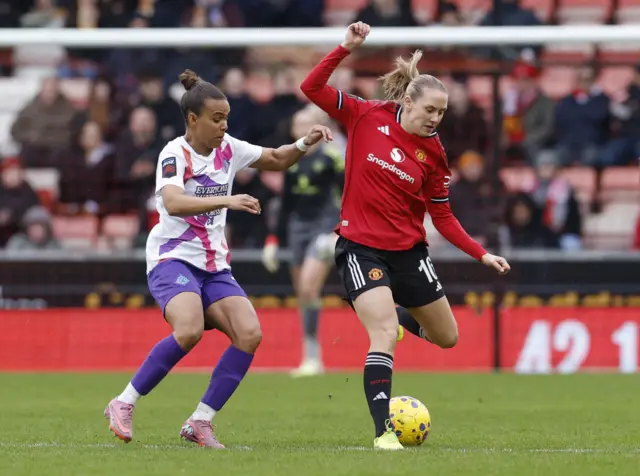 Manchester United's Lisa Naalsund in action with London City Lionesses' Nikita Parris