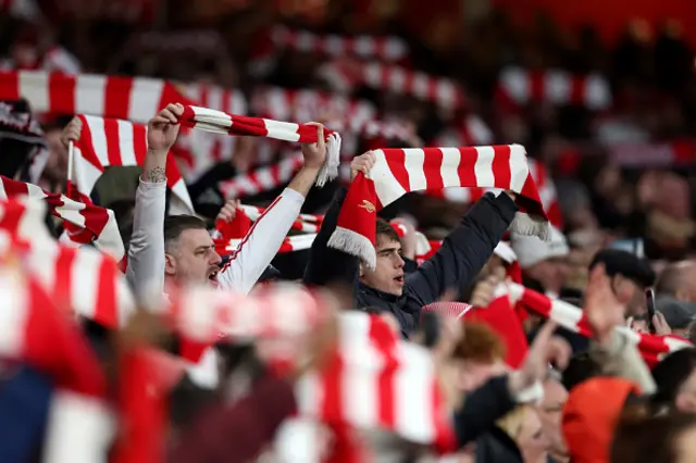 Fans of Arsenal enjoy the atmosphere inside the stadium