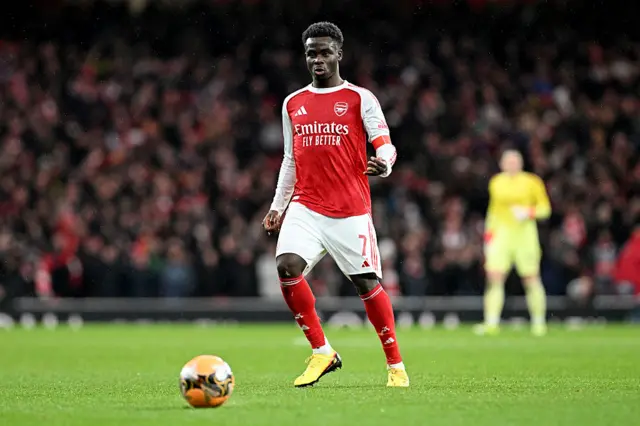 Bukayo Saka of Arsenal runs with the ball