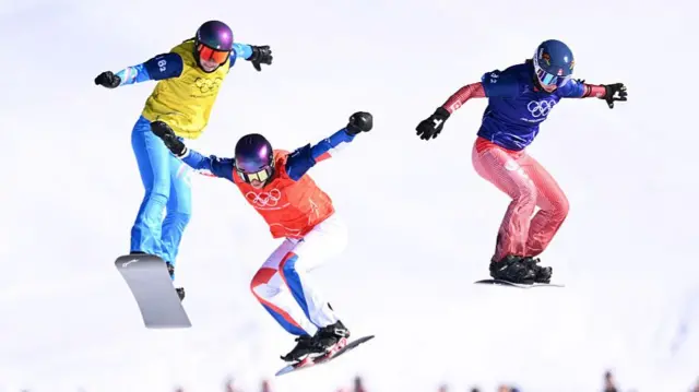 Snowboarders in action