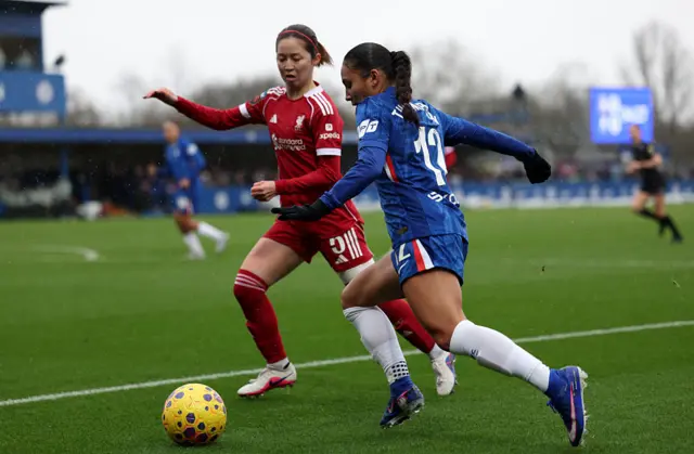 Risa Shimizu of Liverpool battles for possession with Alyssa Thompson of Chelsea
