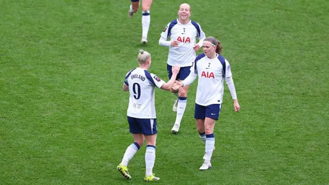 Bethany England of Tottenham Hotspur celebrates scoring her team's second goal with teammate Signe Gaupset