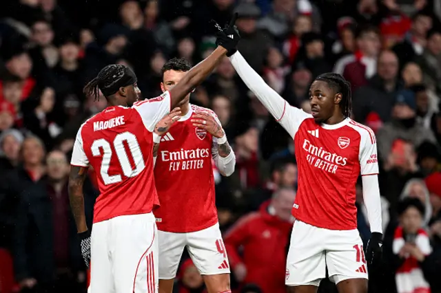 Noni Madueke of Arsenal celebrates scoring his team's first goal with teammate Eberechi Eze