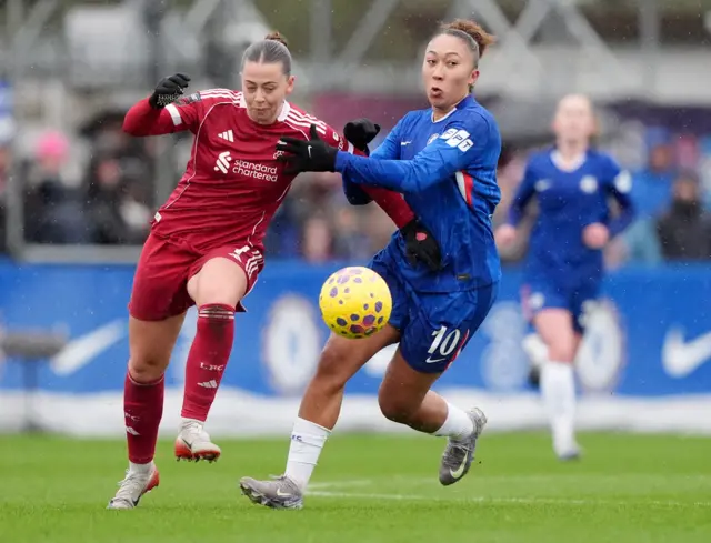 Chelsea's Lauren James and Liverpool's Cornelia Kapocs battle for the ball during the Barclays Women's Super League match at Kingsmeadow, London
