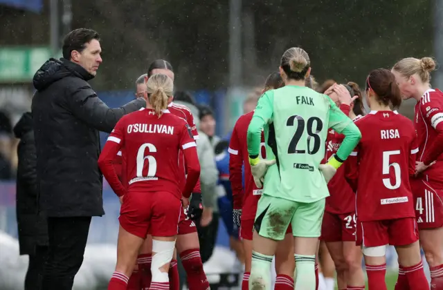 Liverpool manager Gareth Taylor talks to players during a break in play