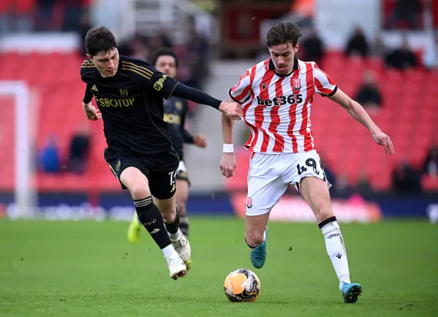 Milan Smit of Stoke City is challenged by Jorge Cuenca